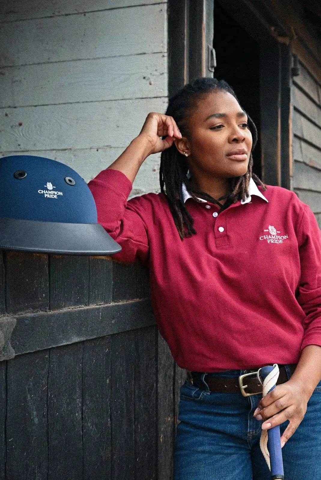Champion Pride Polo League rider in a burgundy league polo shirt